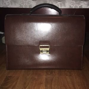 Leather suitcase with strap